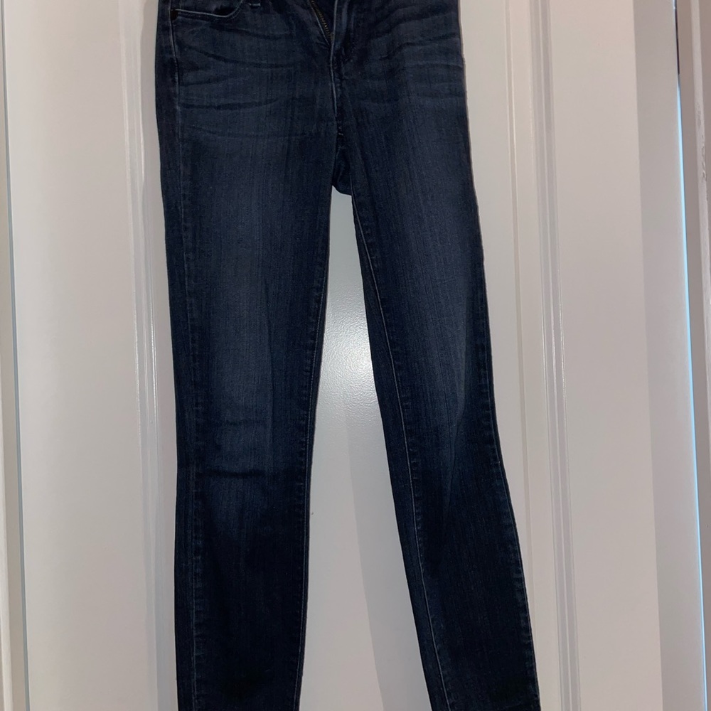 Paige mid rise skinny jeans with frayed bottom hem. Dark wash. 
Size: 23